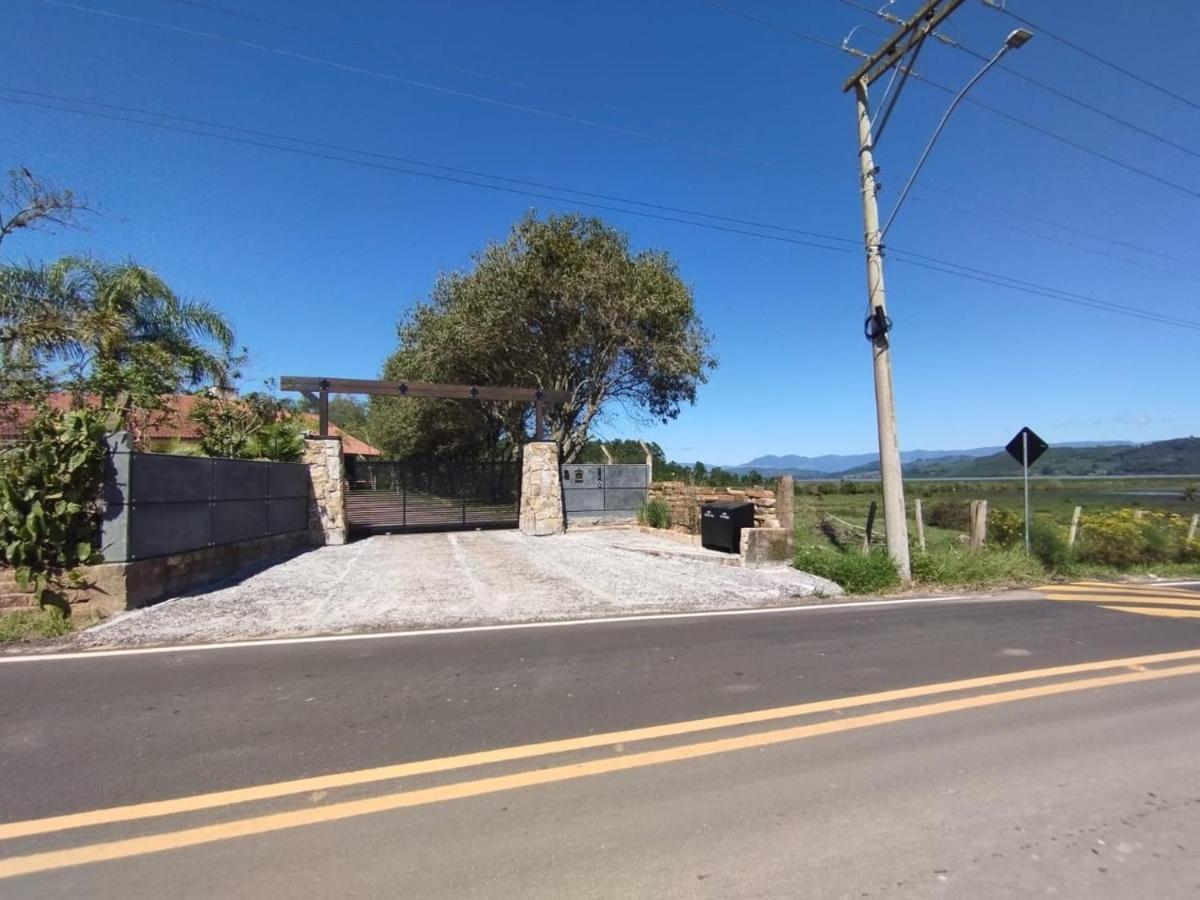 Sítio em Torres com Piscina e vista para Lagoa da Itapeva - Sítio Éden - Ferienwohnung Torres
