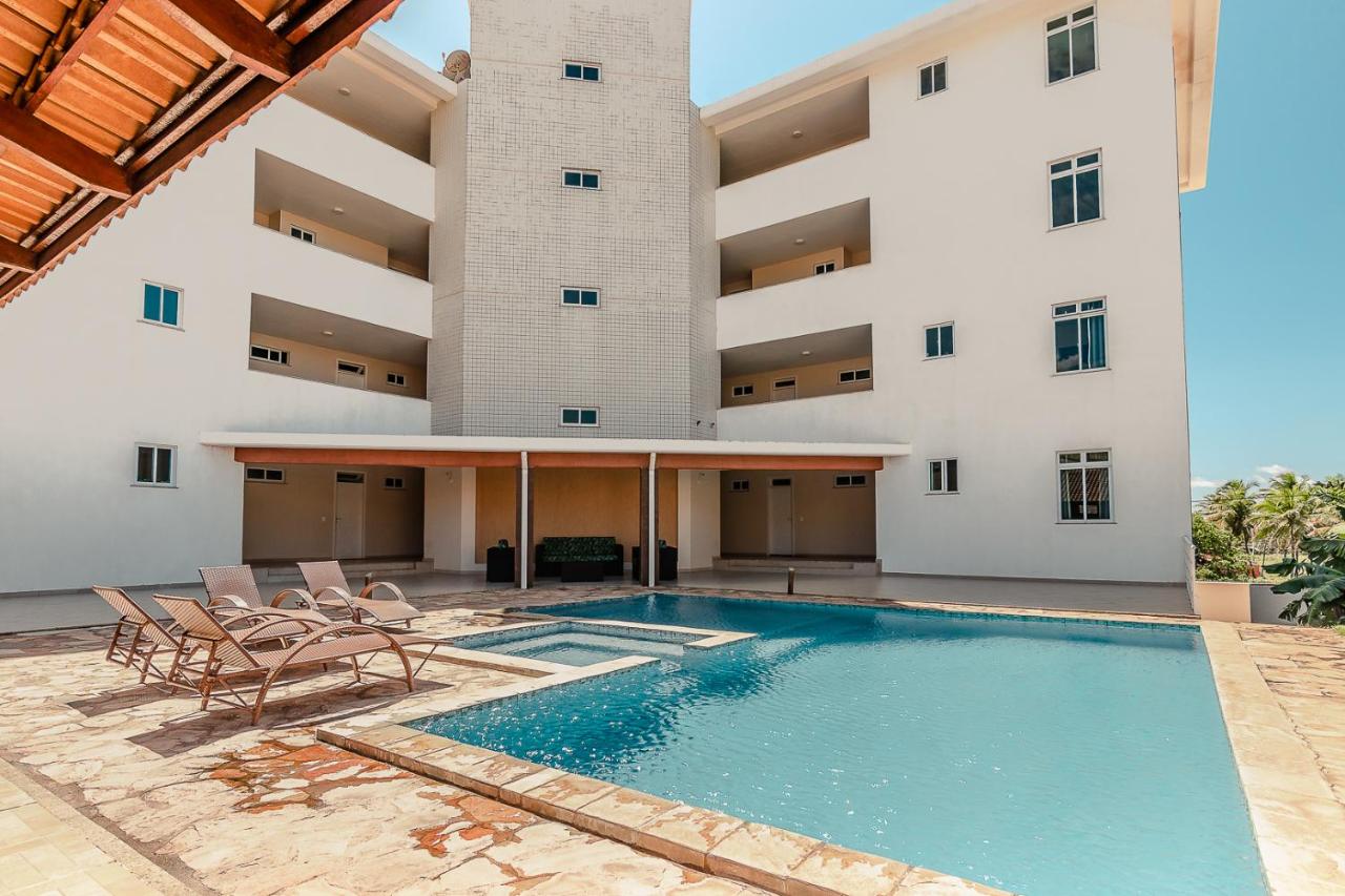 2 suítes temporada - VENTILADO E NASCENTE, condomínio tranquilo com PISCINA, CHURRASQUEIRA E PLAYGROUND I Cozinha completa, estacionamento coberto, home office I Ideal para FAMÍLIAS E CASAIS I Prox do BEACH PARQUE e PRAIA - Porto das Dunas - CE - Bed and Breakfast