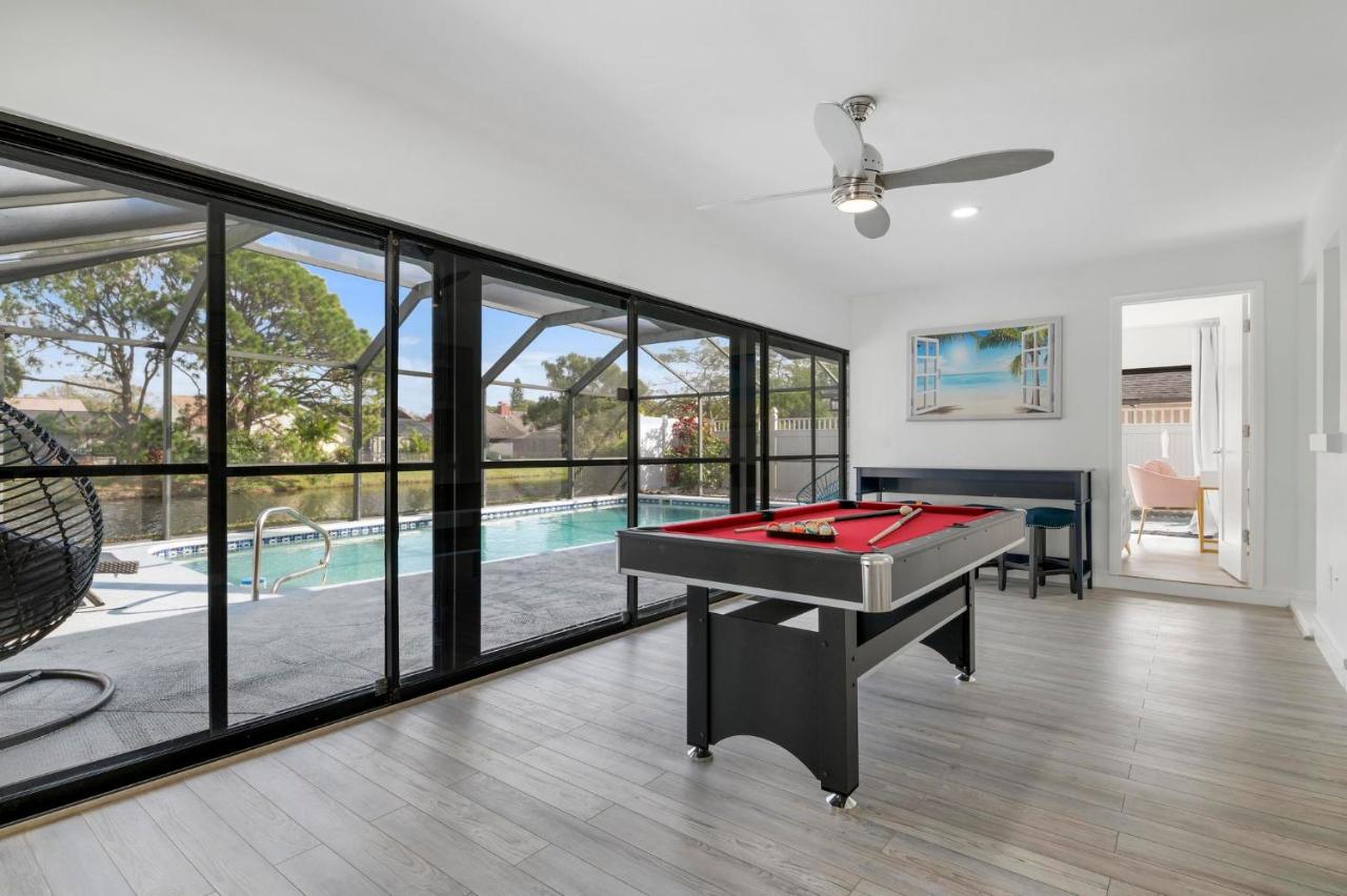 Tropical Tranquility! Luxury pool home with lakefront view just minutes from the beach! - B&B