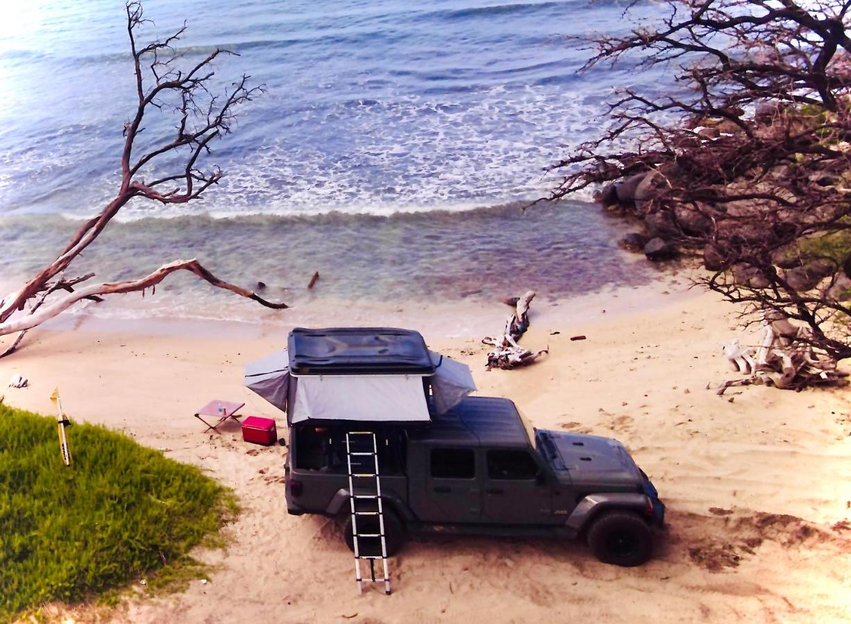 Embark on a journey through Maui with Aloha Glamp's jeep and rooftop tent allows you to discover diverse campgrounds, unveiling the island's beauty from unique perspectives each day - B&B Paia