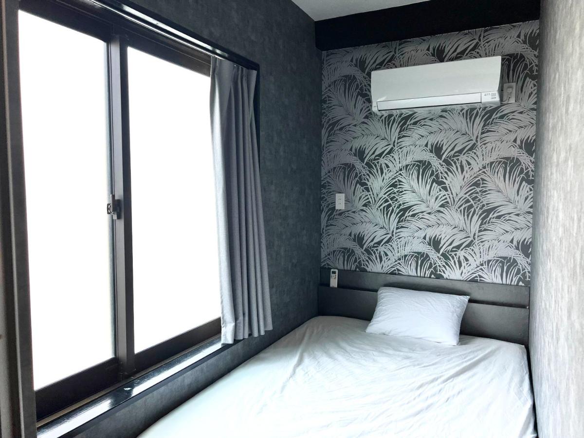 ゲストハウス JOOOY Hotel 奄美 - Chambres d’hôtes
