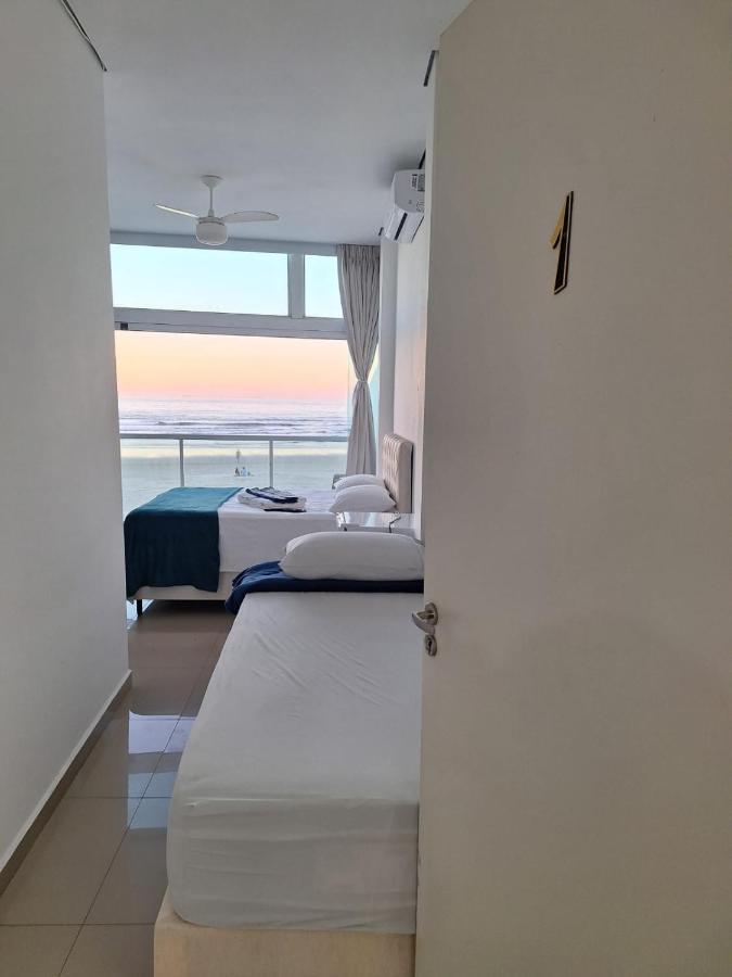 Suítes Pitangueiras - POUSADA FRENTE MAR - Ferienwohnung Guarujá