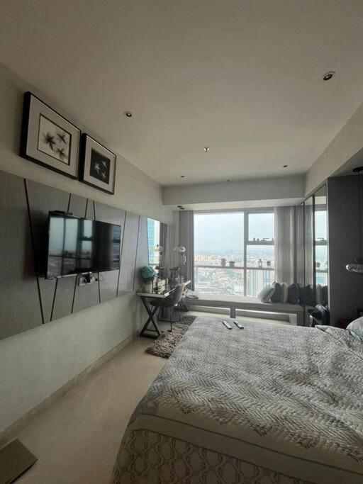 Apartemen one icon residence - Bed and Breakfast