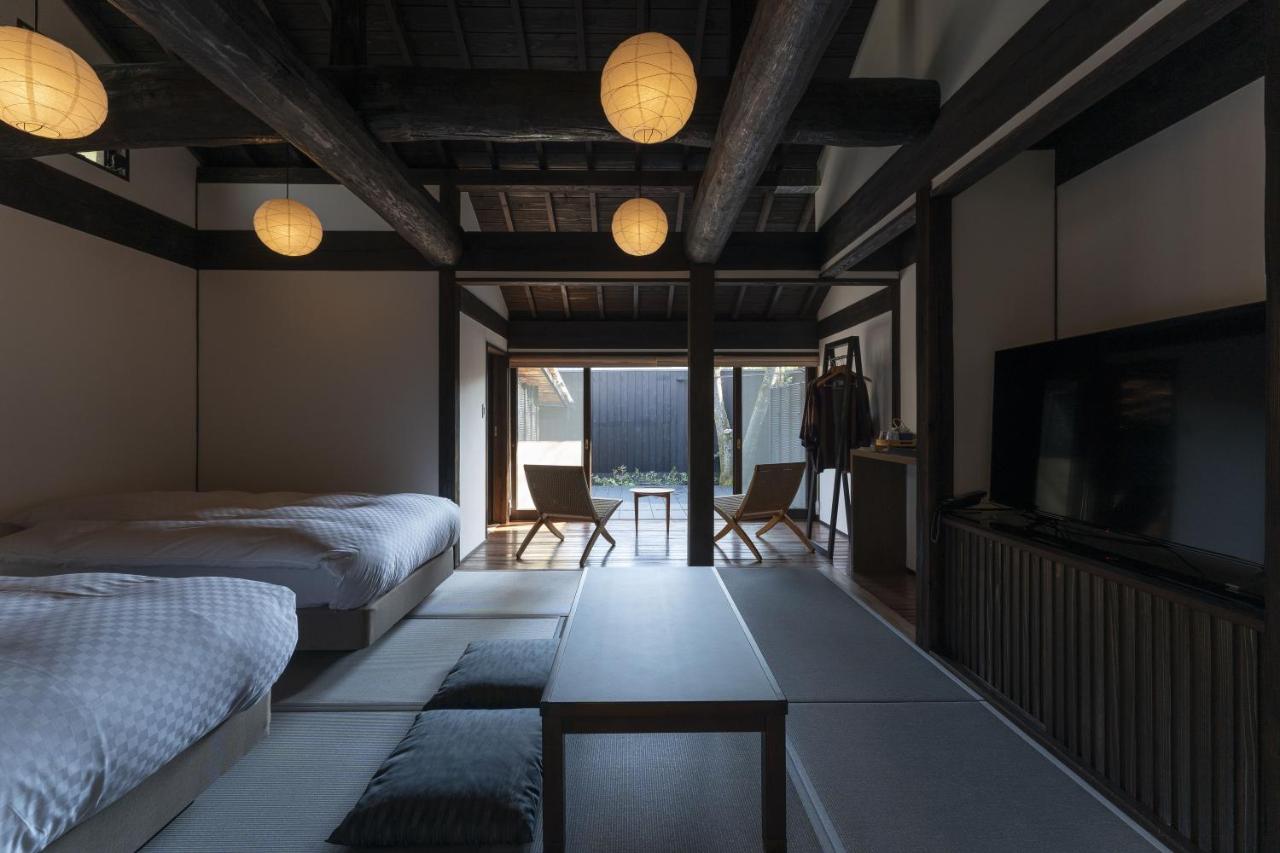 Chambre Lits Jumeaux de Luxe avec Baignoire en Plein Air