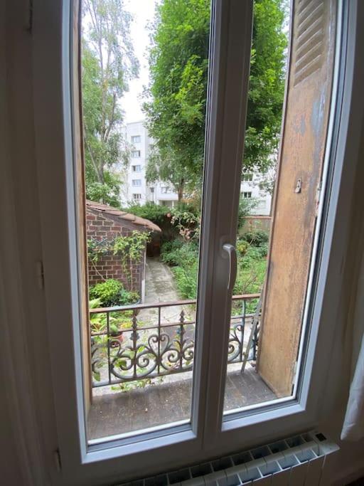 Appartement de charme près du Stade de France - B&B
