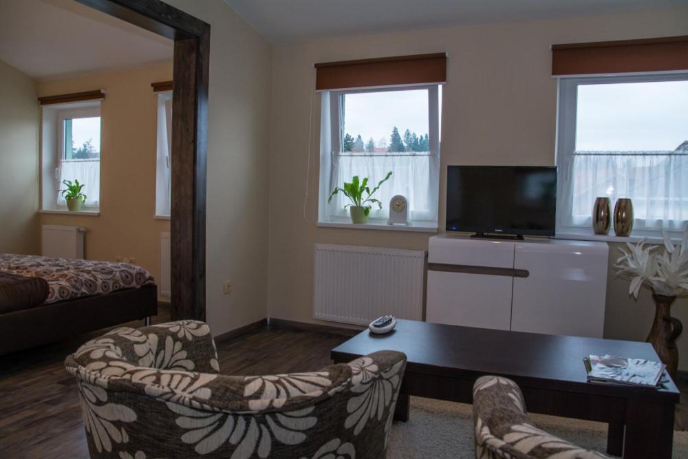 DŮM POD RADNICÍ pokoje - Chambres d’hôtes