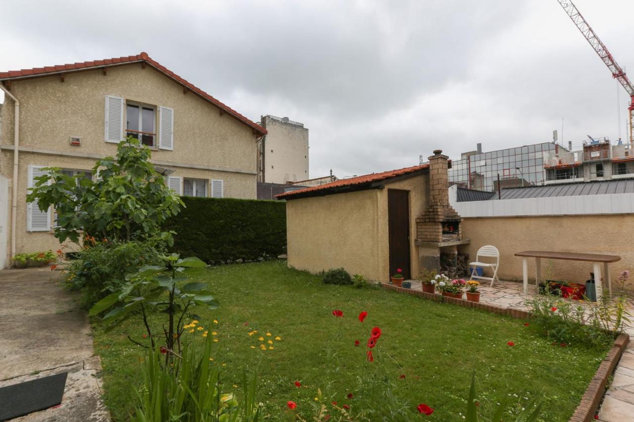 Family house with garden in Courbevoie - B&B