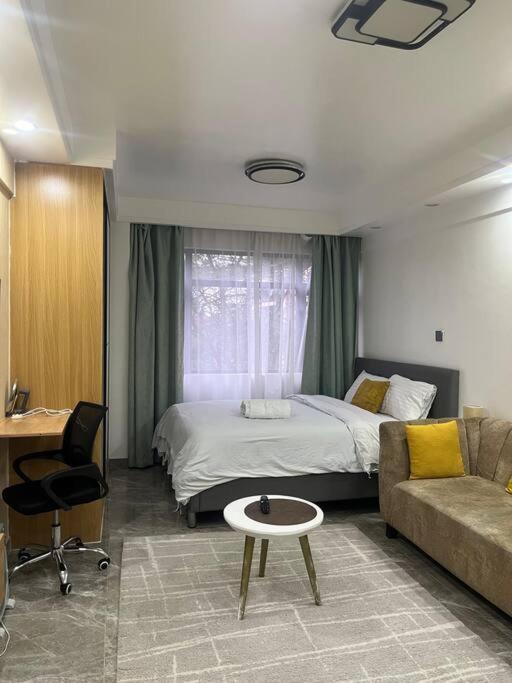 Cosy apartment in Kilimani w free parking & gym - Bed and Breakfast