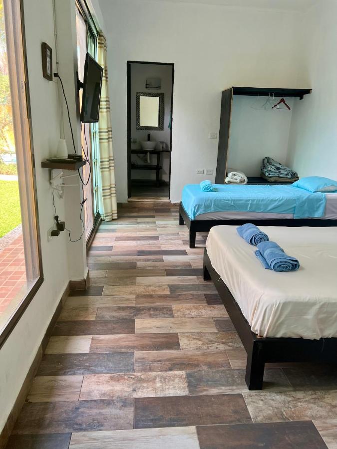 Quadruple Room with Balcony and view to the garden and pool