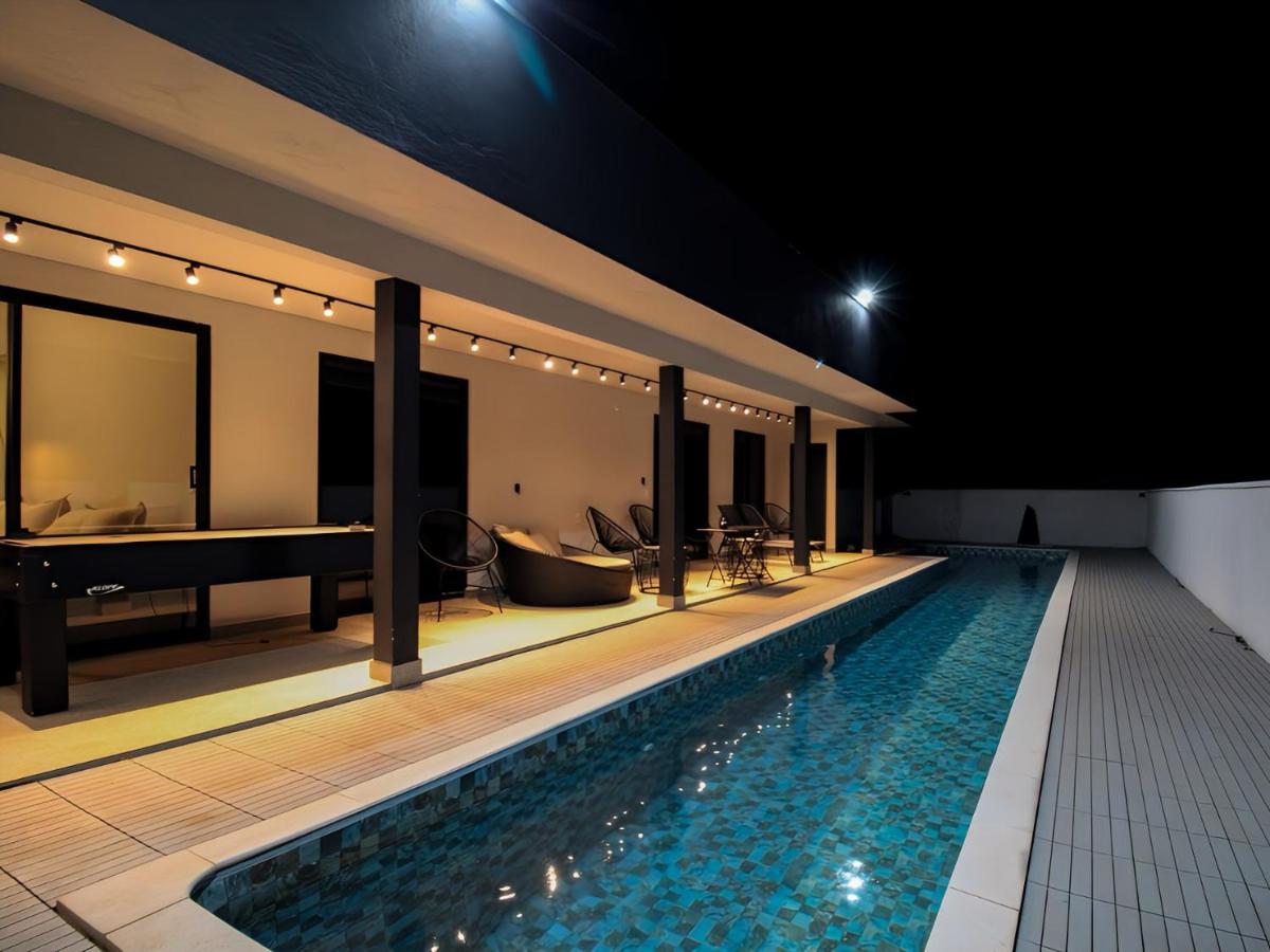 Casa com piscina aquecida e acesso ao clube em Riviera - Ferienwohnung Palmeiras