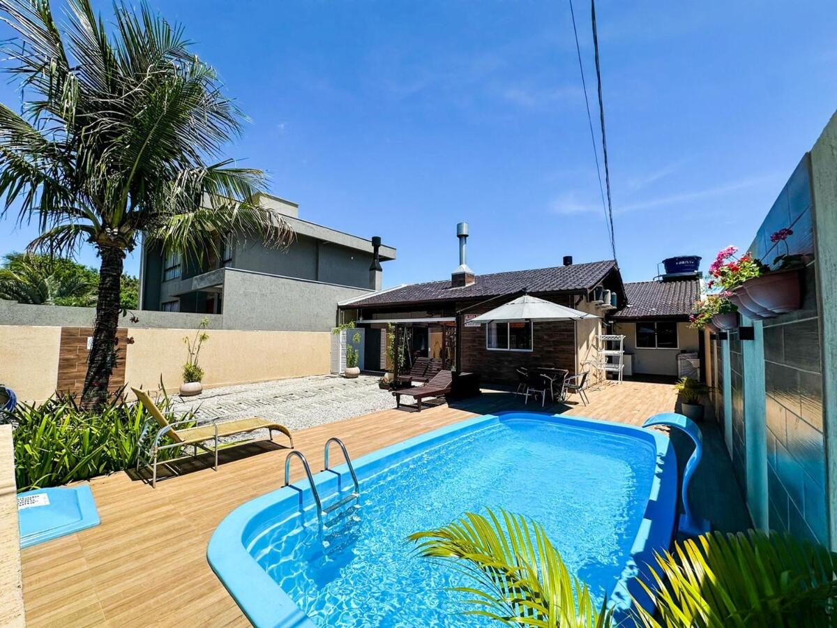 CASA GOLFINHO 348 - casa aconchegante com piscina, churrasqueira, mesa de sinuca e jogos - Ferienwohnung