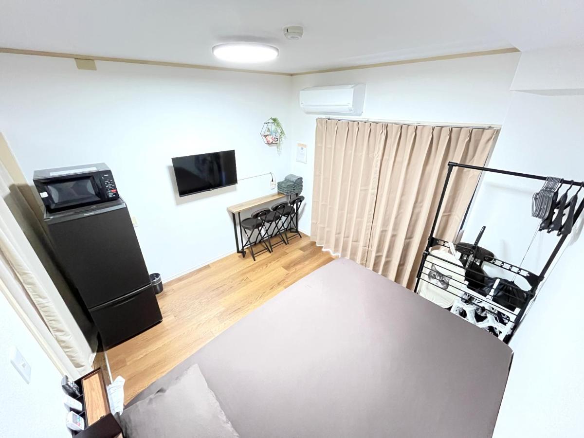 One-Bedroom Apartment with Balcony and City View