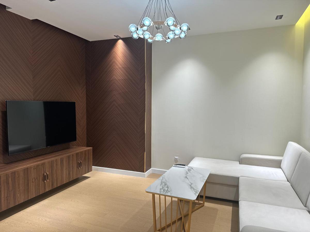 One-Bedroom Apartment with Balcony and City View