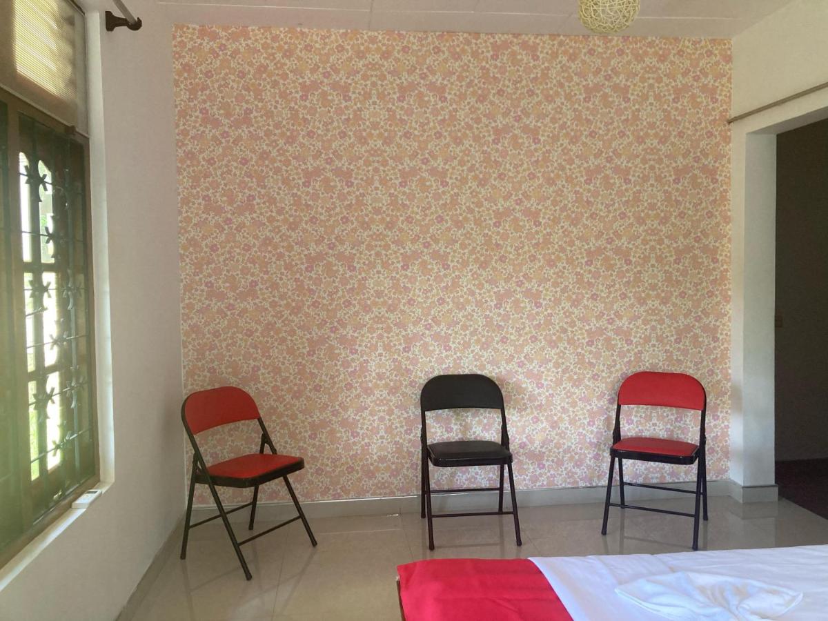Dreibettzimmer mit Gartenblick
