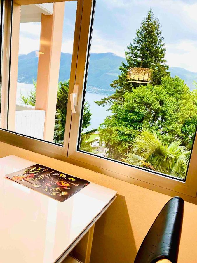 Spectacular penthouse with lake views in central Brissago - Chambres d’hôtes