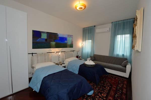 Tweepersoonskamer met 1 of 2 Bedden en Gedeelde Badkamer