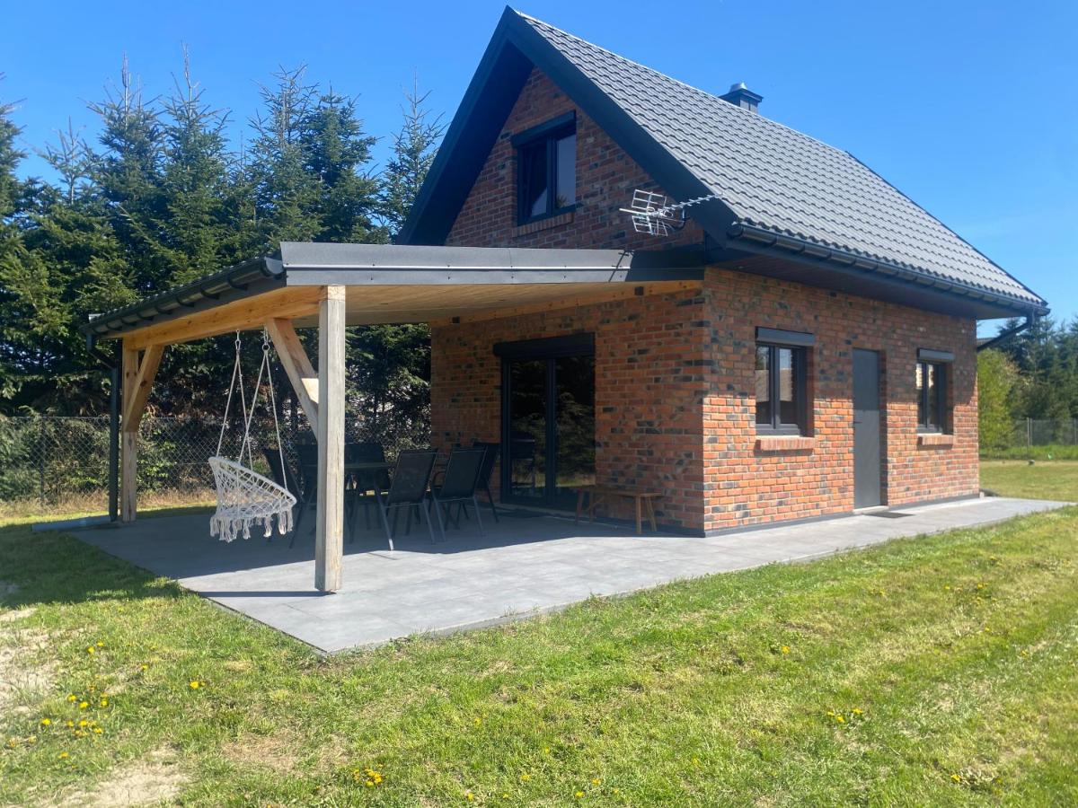 Domek Radawa, Koguty