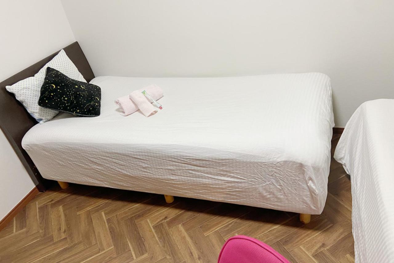 Tweepersoonskamer met 1 of 2 Bedden en Gedeelde Badkamer