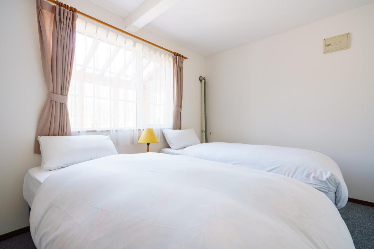 Tweepersoonskamer met 2 Aparte Bedden