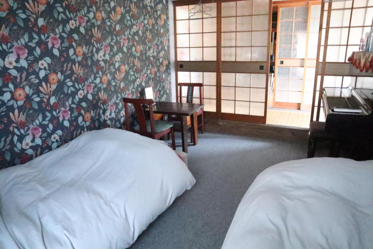 Tweepersoonskamer met 2 Aparte Bedden