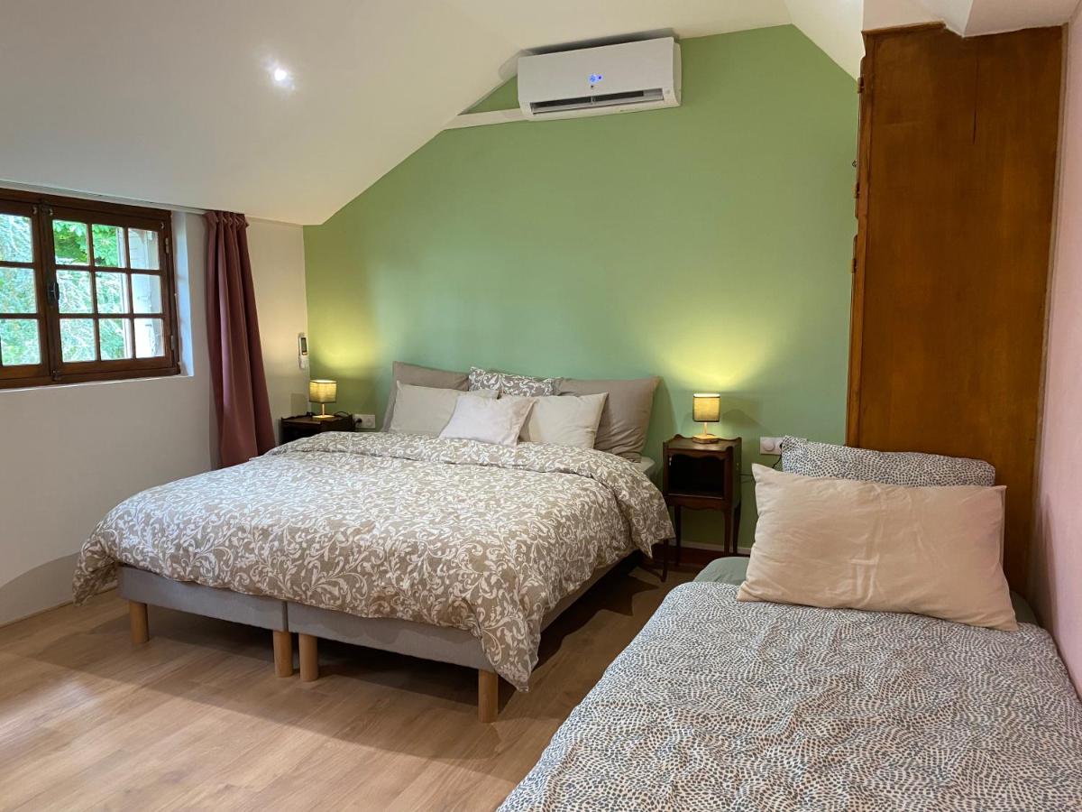 Dreibettzimmer mit Gartenblick