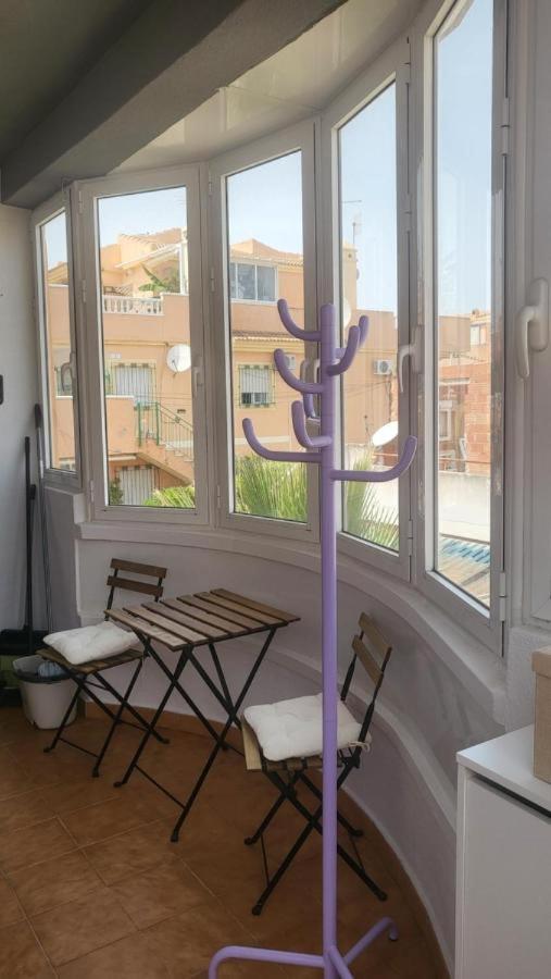 Green Veranda - cosy apartment with terrace, grill, chimney and pool - B&B Urbanizacion los Balcones