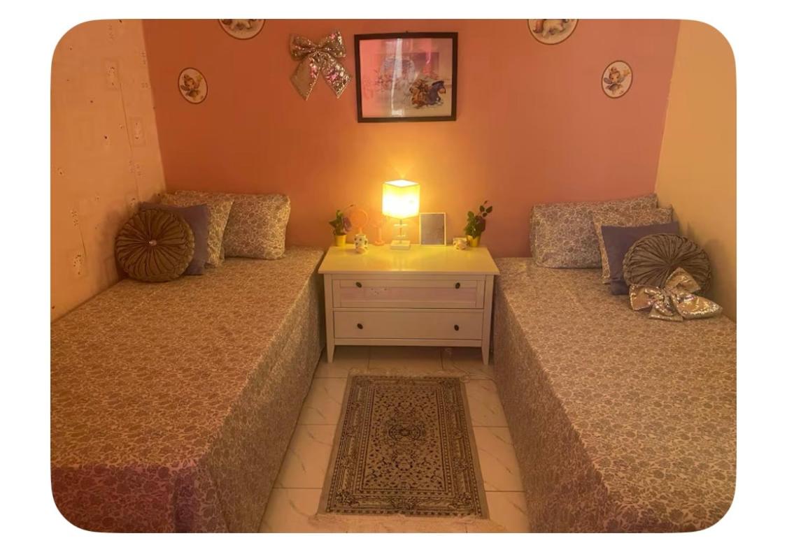 Chambre lits face to face, serviettes, café ou thé offert - B&B Dakar