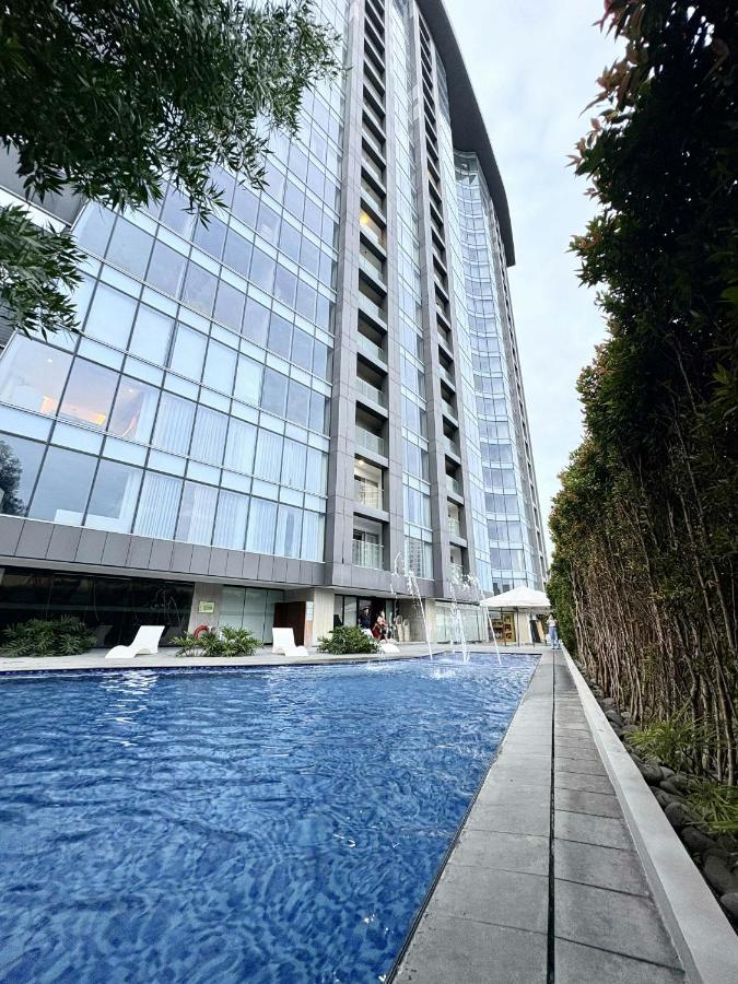 Minimalist 1BR Condo with NETFLIX at AEON TOWERS near Abreeza Mall by Rico - Chambres d'hôtes Davao