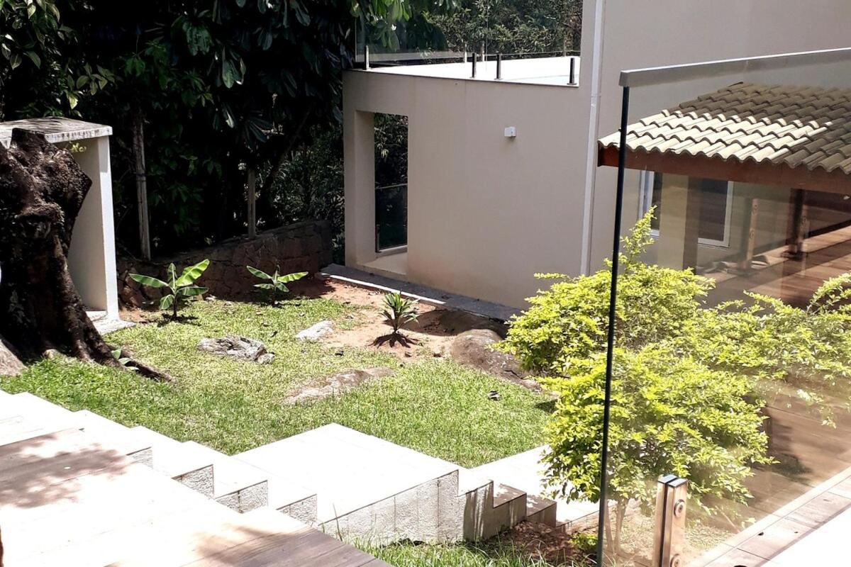 Casa com varanda, ar condicionado pet friendly - Chambres d'hôtes Ilhabela