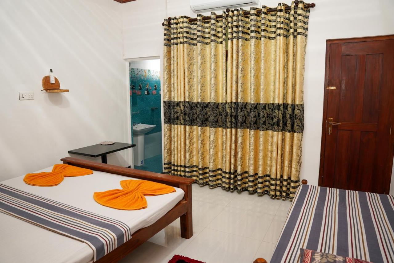 Camera Tripla con Vista Giardino