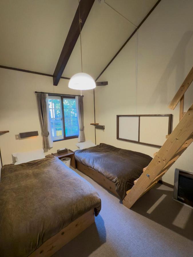 Camera Familiare con Bagno in Comune