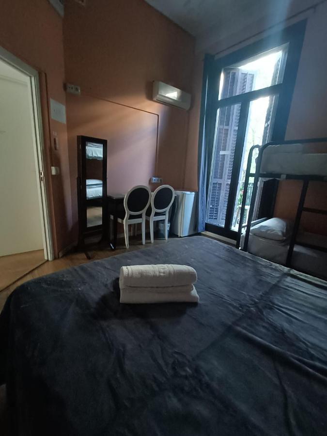 Double room with two extra beds and private external bathroom.