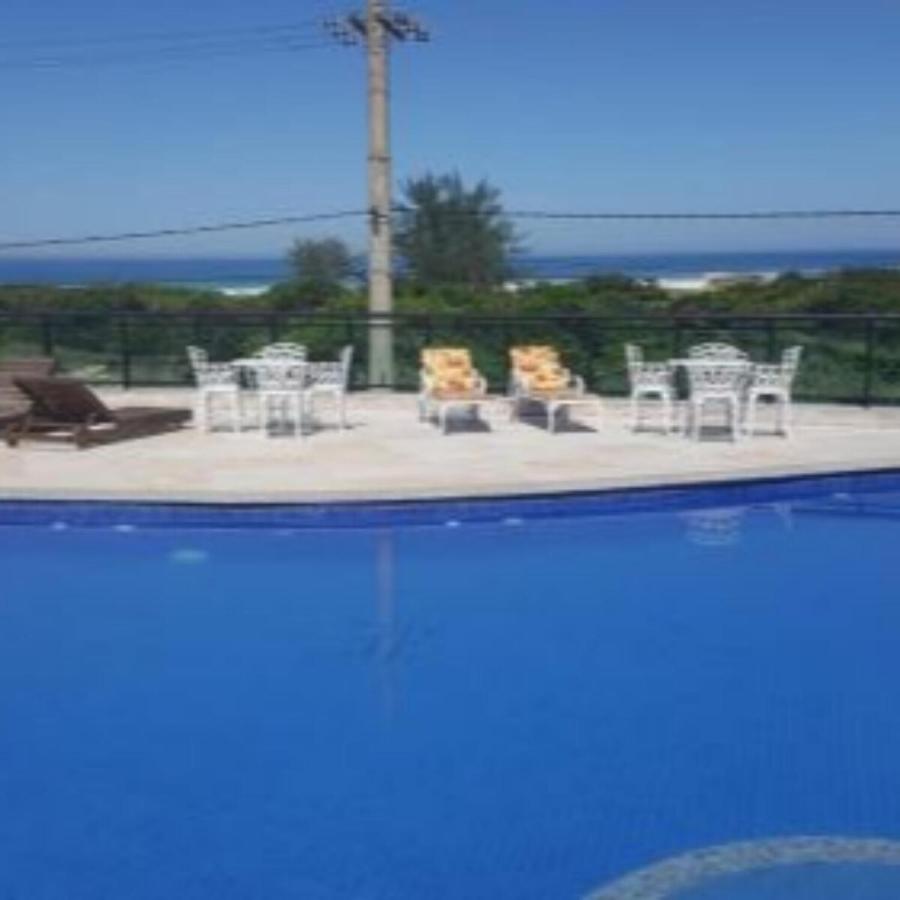 Apartamento em condomínio frente ao mar com piscina - B&B Arraial do Cabo