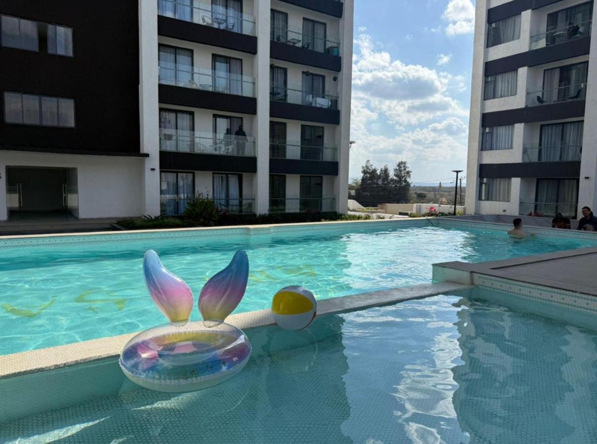 Cozy 1BR Luxury Suites near the Airport with pool, gym & city views - B&B Nairobi