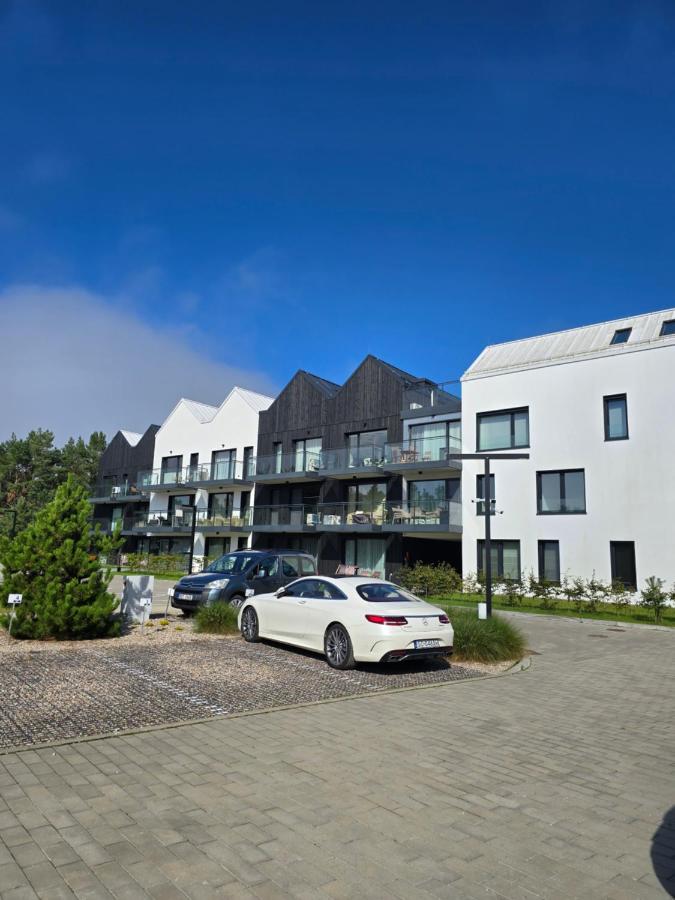 Apartament w lesie nad morzem i jeziorem Porto Łeba z ogródkiem - Chambres d'hôtes Łeba