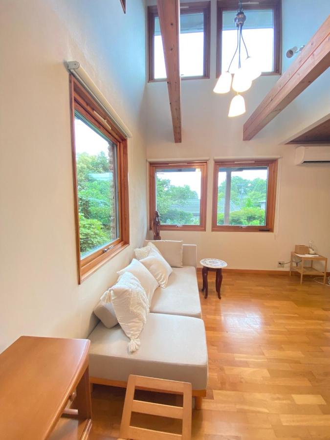 天然温泉と広い庭でくつろぐ漆喰壁のスウェーデンハウス - Ferienwohnung Itō
