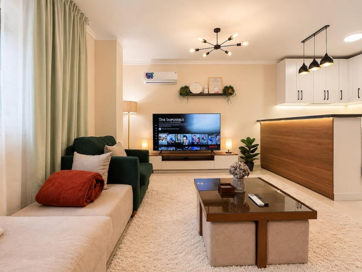 Cozy 1BR Apartment with GardenView - Chambres d'hôtes Le Caire