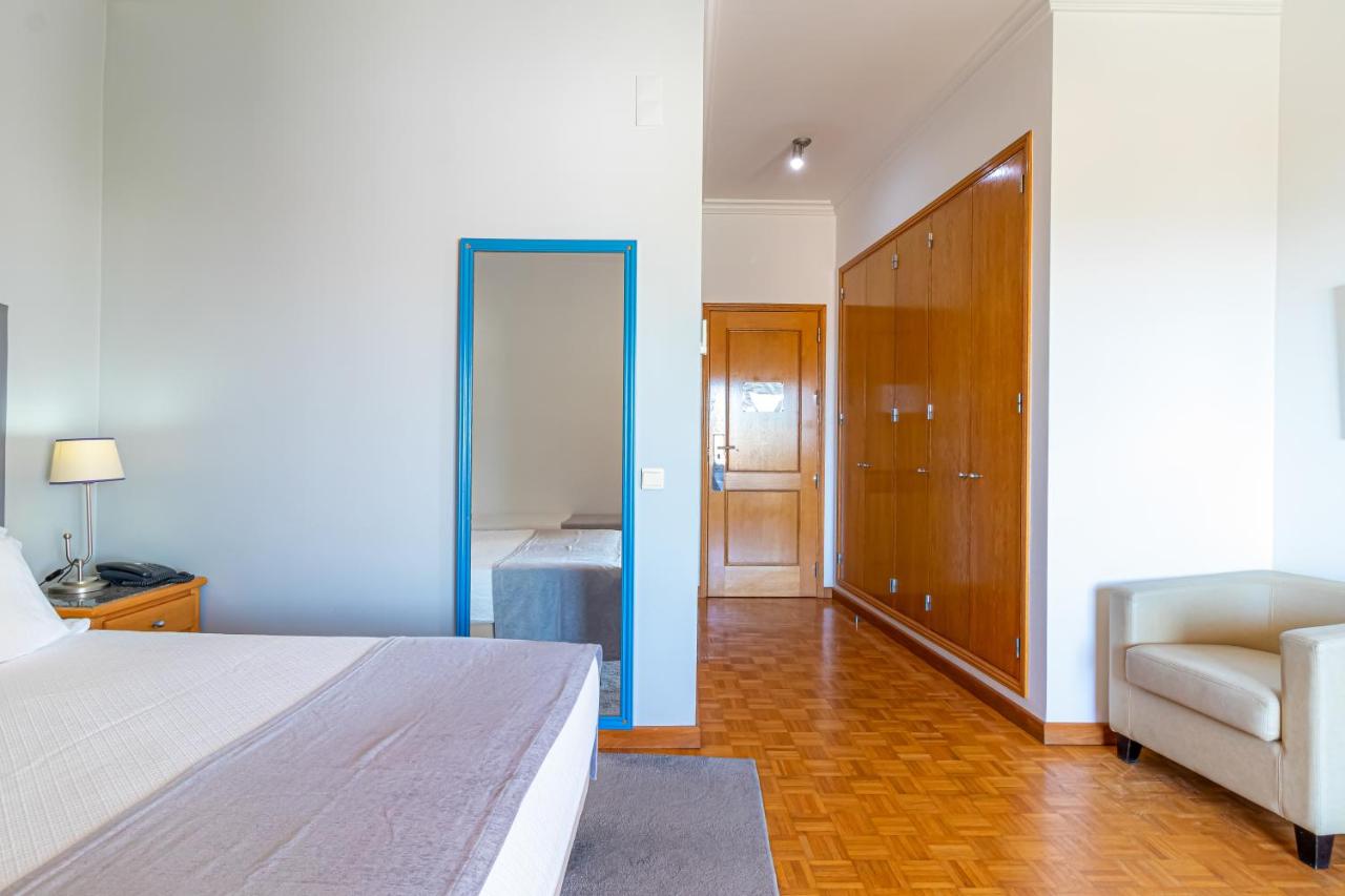 Beige armchair sits at dog-friendly Hotel Maritur - Adults Only in Albufeira.