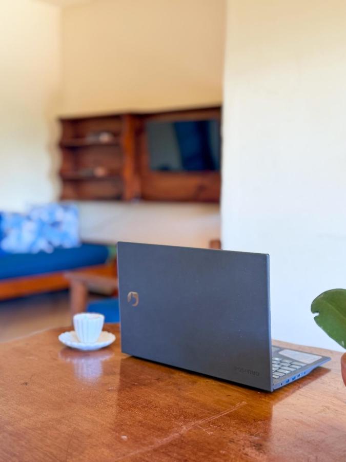 Gray laptop with silver logo sits at dog-friendly Casa Magna in Itacare.