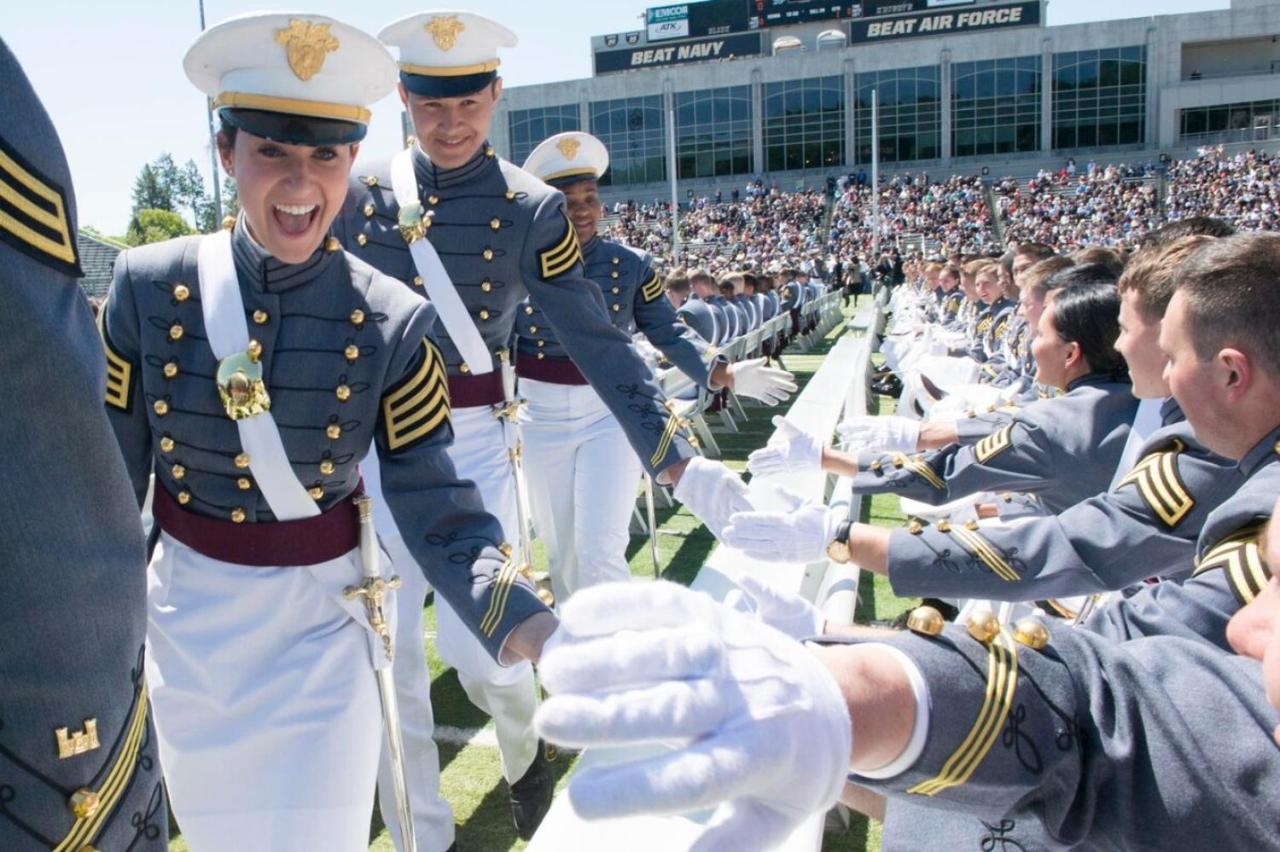 Cadet in gray-and-white uniform high-fives at dog-friendly Parkway House Goshen Bed and Breakfast Suite 1 in Goshen, NY.
