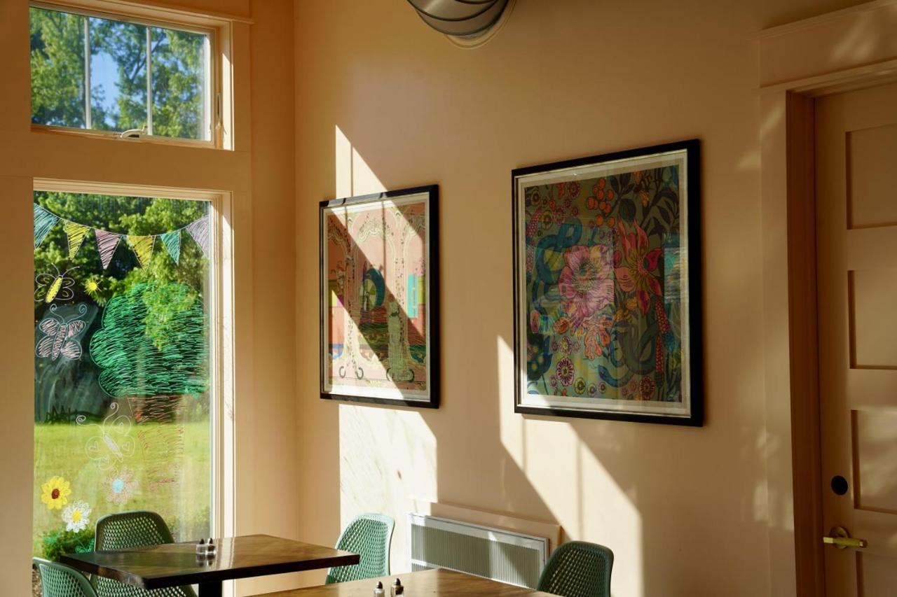 Framed floral print hangs at pet-friendly Parkway House Goshen Bed and Breakfast Suite 1 in Goshen, NY.