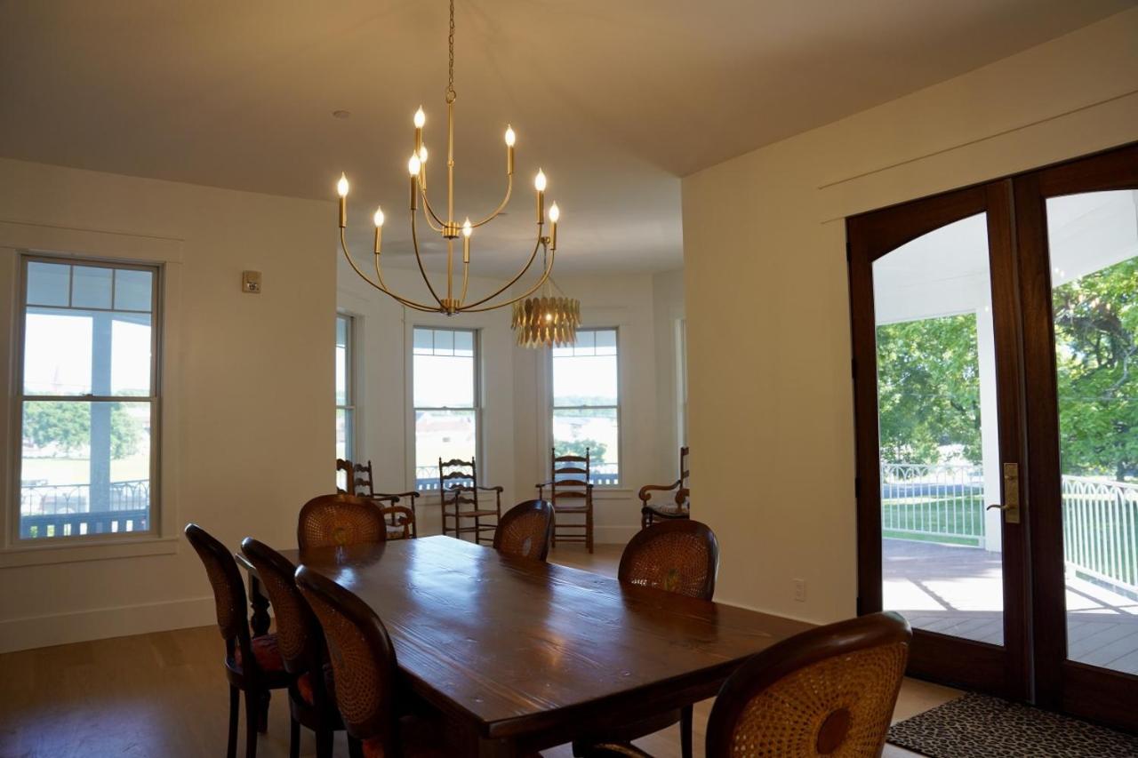 Dark table with six chairs sits at dog-friendly Parkway House Goshen Bed and Breakfast Suite 1 in Goshen, NY.