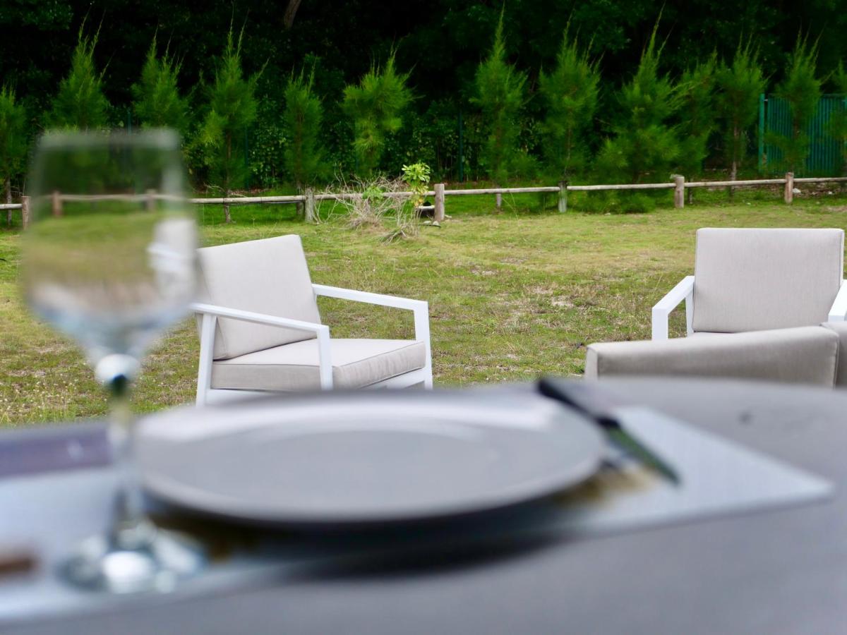 Charmant bungalow T2 avec grand jardin et accès privé plage - Ferienwohnung Grand-Bourg