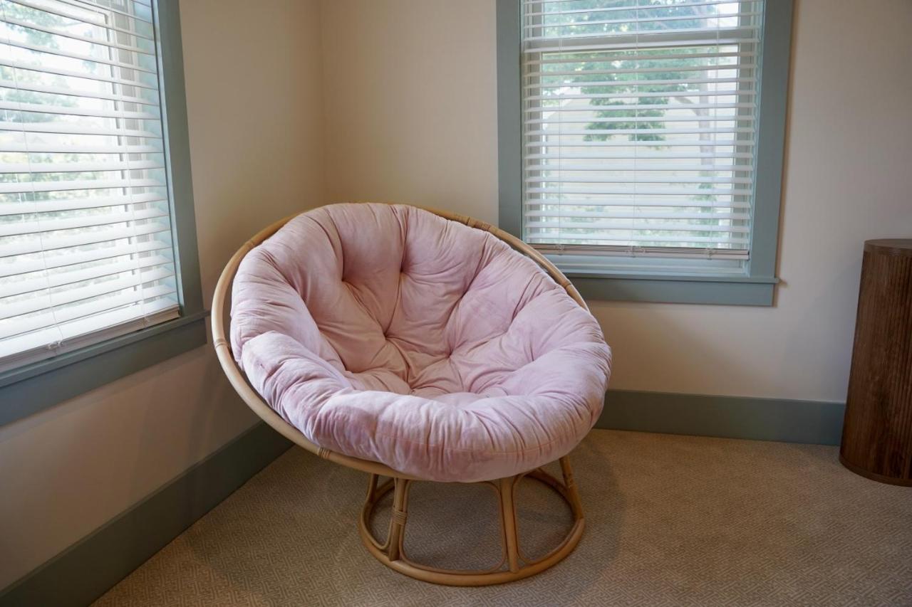 Round chair with pink cushion sits at pet-friendly Parkway House Goshen Bed and Breakfast Suite 1 in Goshen, NY.
