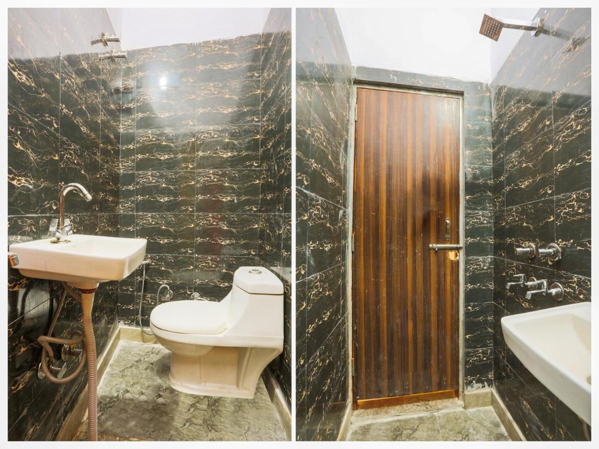 White ceramic toilet sits at dog-friendly Hotel O Jps DC Residency in New Delhi.