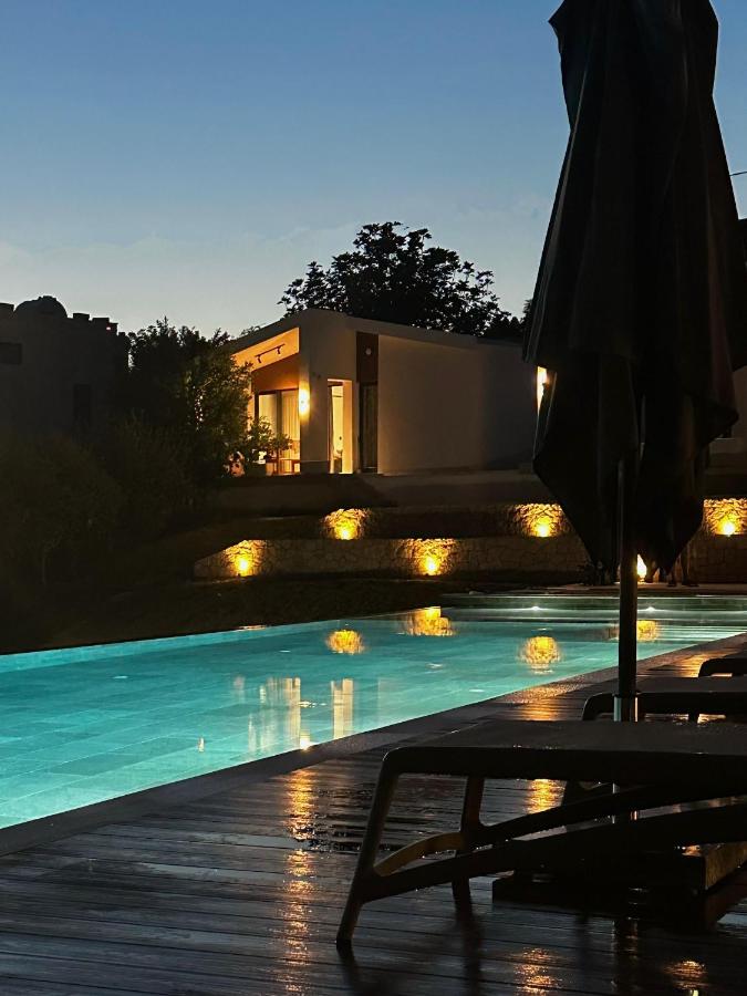 Black closed umbrella stands at dog-friendly Casa Mila Apartments & Bungalows in Ulcinj.