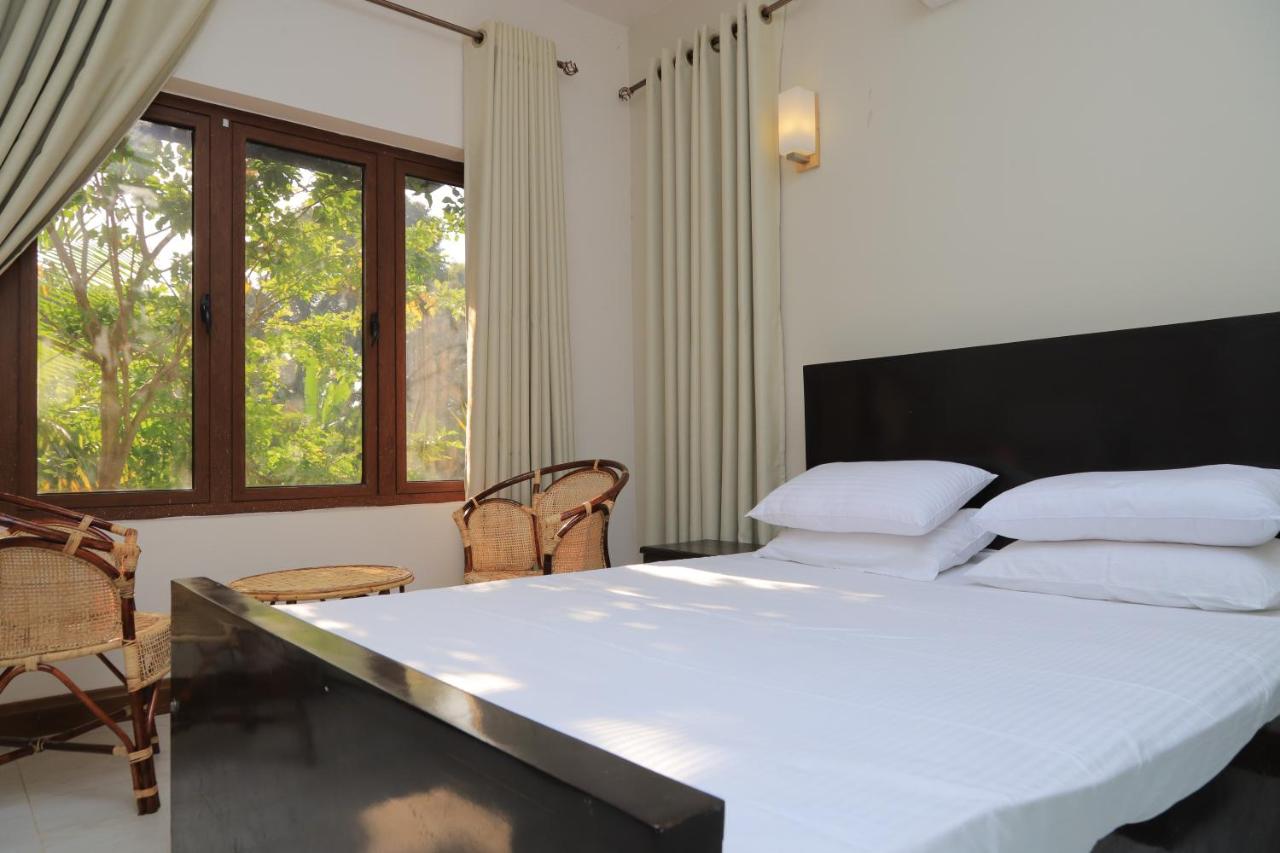 Chambre Double ou Lits Jumeaux Deluxe – Vue sur Jardin