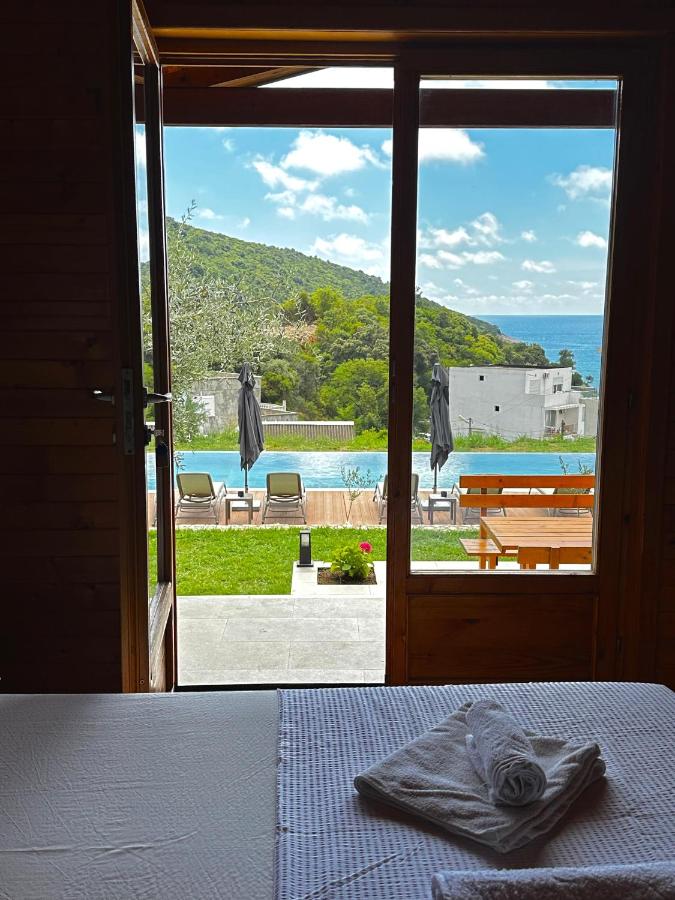 White folded towel resting on bed at pet-friendly Casa Mila Apartments & Bungalows in Ulcinj.