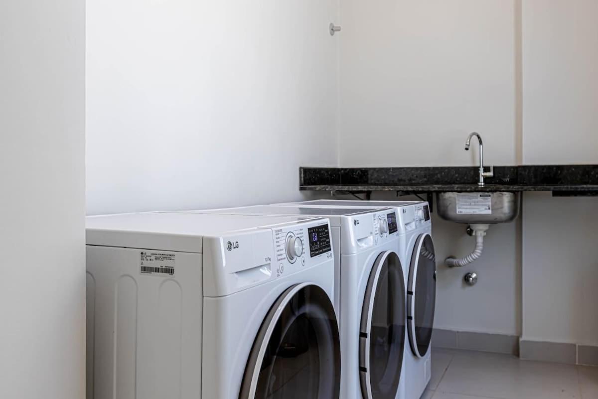 Three white washers sit at pet-friendly Sky Stays at Asuncion Cozy & Bright 1 BDR in Asunción.