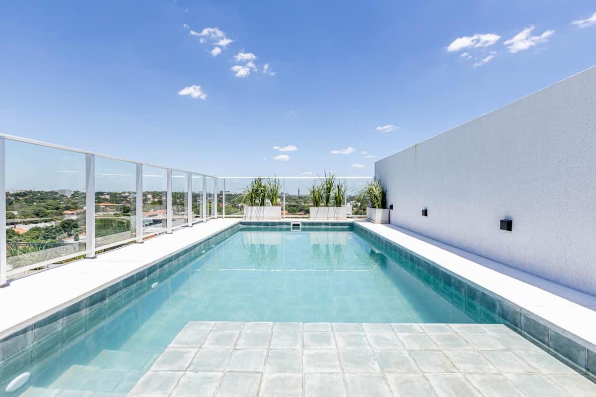 Blue tiled pool sits at pet-friendly Sky Stays at Asuncion Cozy & Bright 1 BDR in Asunción.